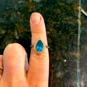 Beautiful LeVian London Blue Topaz Ring in a halo of sparkling diamonds. 14kt.